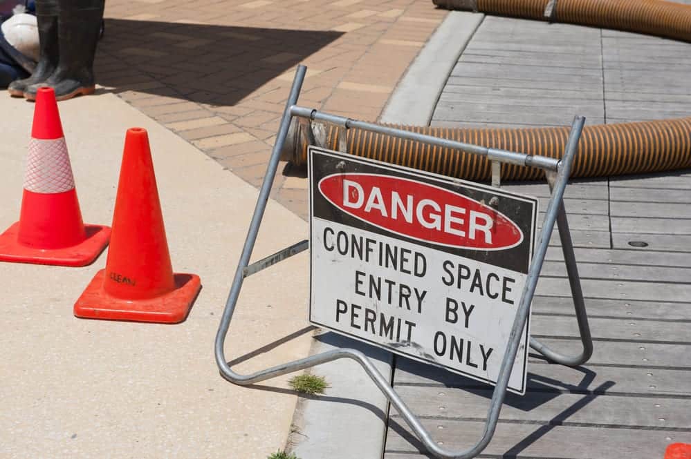 Sign reading "Danger -- Confined Space Entry by Permit Only"