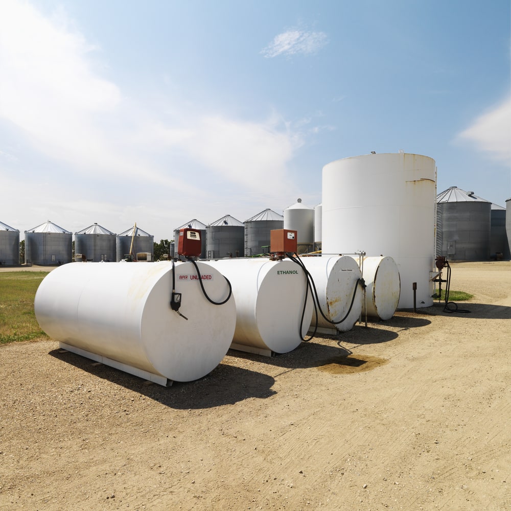 Several white fuel tanks and pumps